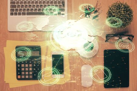 Double exposure of social network theme drawing over table with phone. Top view. People connecting concept.の写真素材