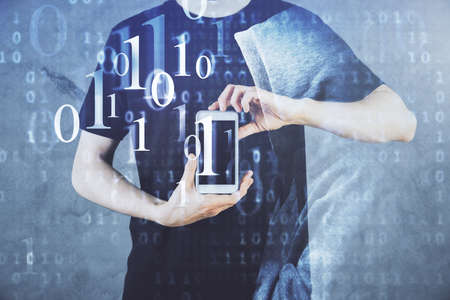 Double exposure of man's hand holding and using a digital device and data theme hologram drawing....
