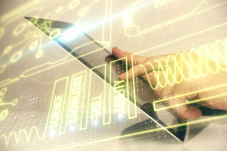Double exposure of mans hands holding and using a phone and education theme drawing.