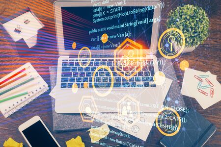 Double exposure of laptop computer and technology theme hologram. Concept of freelance work.の写真素材