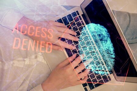 Double exposure of woman hands working on computer and fingerprint hologram drawing. Top View....