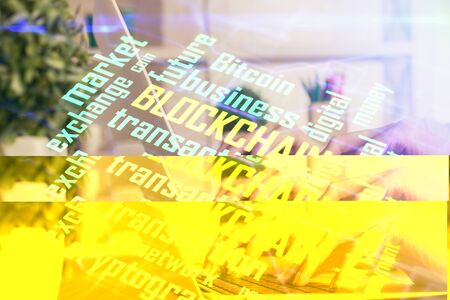 Double exposure of woman hands typing on computer and crypto market theme hologram drawing. Blockchain concept.の写真素材
