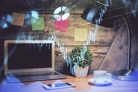 Double exposure of chart and financial info and work space with computer background. Concept of international online trading.の写真素材