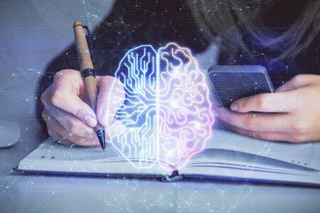 Multi exposure of woman hands working on computer and human brain hologram drawing. Ai tech concept.の写真素材