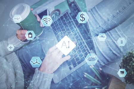 Double exposure of woman hands working on computer and data theme hologram drawing. Tech concept.の写真素材