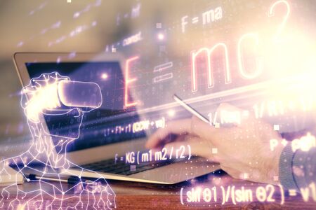 Double exposure of man's hands holding and using a phone and formulas drawing. Education concept.の写真素材