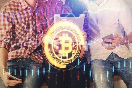 Double exposure of crypto theme drawing and man and woman working together holding and using a mobile device. Blockchain concept.の写真素材