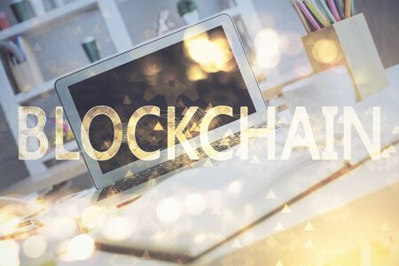 Multi exposure of blockchain and crypto economy theme hologram and table with computer background. Concept of bitcoin cryptocurrency.の写真素材