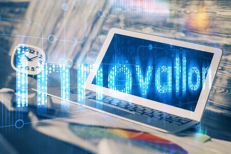 Double exposure of laptop computer and technology theme hologram. Concept of freelance work.の写真素材