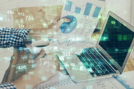 Multi exposure of technology hologram with man working on computer background. Concept of big data.