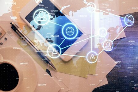 Double exposure of social network theme drawing over table with phone. Top view. People connecting concept.の写真素材