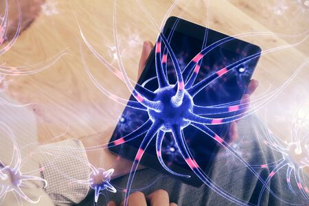Double exposure of man's hands holding and using a phone and neuron drawing. Education concept.の写真素材