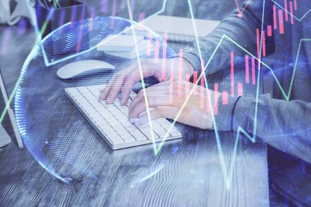 Multi exposure of financial graph with man works in office on background. Concept of analysis.