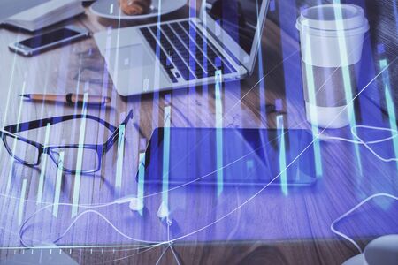 Double exposure of forex chart drawing and cell phone background. Concept of financial trading