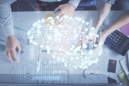 Double exposure of man and woman working together and human brain hologram drawing. Brainstorm...