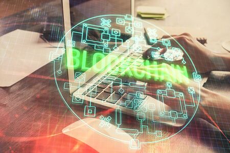Double exposure of woman hands typing on computer and crypto market theme hologram drawing....