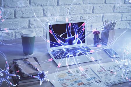 Desktop computer background and neuron drawing. Double exposure. Education concept.の写真素材