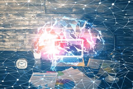 Multi exposure of work space with computer and human brain hologram. Brainstorm concept.