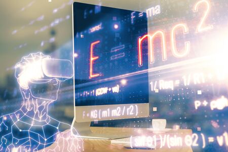 Desktop computer background and formula hologram writing. Double exposure. Education concept.
