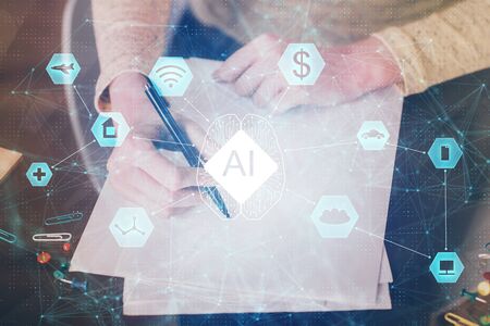 Double exposure of writing hand on background with data solution technology hologram. Ai concept.の写真素材