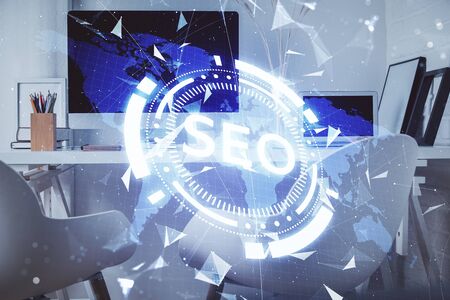 Double exposure of SEO drawing and office interior background. Concept of Search optimization engine.の写真素材