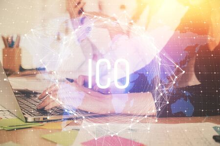 Double exposure of woman hands typing on computer and crypto market theme hologram drawing. Blockchain concept.の写真素材