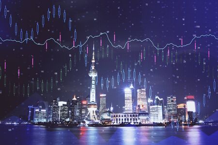 Financial graph on night city scape with tall buildings background multi exposure. Analysis concept.の写真素材
