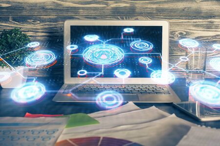 Computer on desktop with social network theme icon. Multi exposure. Concept of international connections.の写真素材