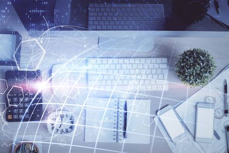 Double exposure of map hologram drawing over study table background with computer. Concept of...