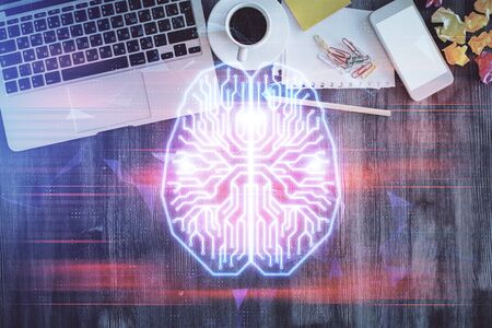 Double exposure of brain drawing hologram over topview work table background with computer. Concept...