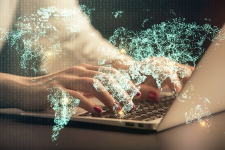 Double exposure of woman hands typing on computer and social network theme hologram drawing. People media concept.の写真素材