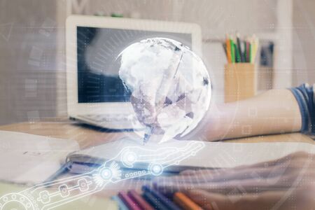 Double exposure of hands making notes with world map hologram and data theme icons. Concept of international network data.の写真素材
