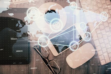 Double exposure of social network theme drawing over table with phone. Top view. People connecting concept.の写真素材