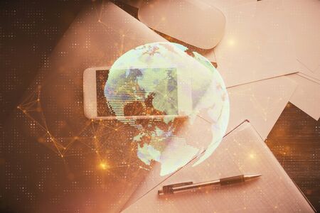 Double exposure of social network theme drawing over table with phone. Top view. People connecting concept.の写真素材