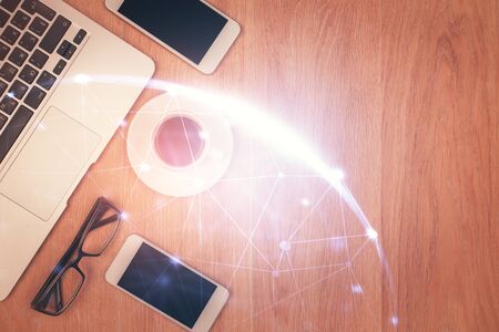 Double exposure of social network theme drawing over table with phone. Top view. People connecting...