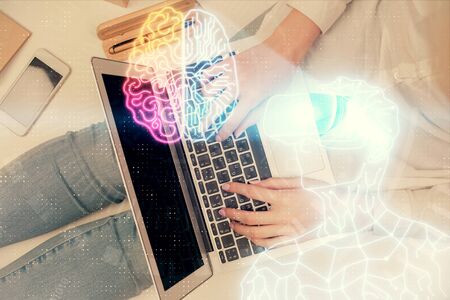 Double exposure of woman hands working on computer and man in ar glasses hologram drawing. Top View. Virtual reality concept.の写真素材