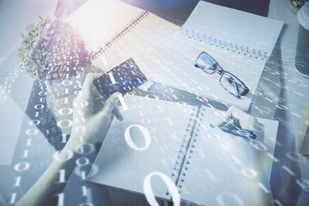 Double exposure of woman on-line shopping holding a credit card and data theme hologram drawing. E-commerce concept.の写真素材