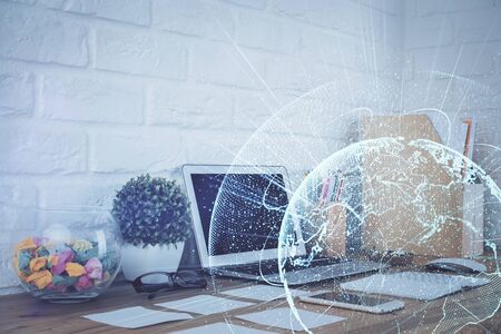 Computer on desktop with social network hologram. Multi exposure. Concept of international people connections.の写真素材