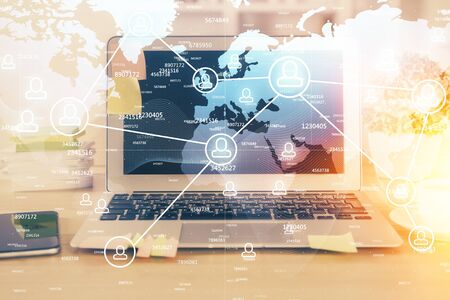 Computer on desktop with social network theme icon. Multi exposure. Concept of international...