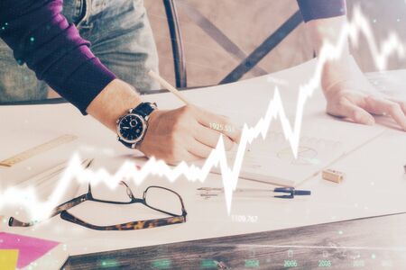 Multi exposure of man standing and planing investment with stock market forex chart background. Concept of research and trading.の写真素材