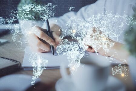 Social network theme hologram over womans hands writing background. Concept of international people connect. Double exposureの写真素材