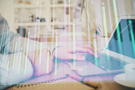 Multi exposure of stock market chart with man working on computer on background. Concept of financial analysis.の写真素材