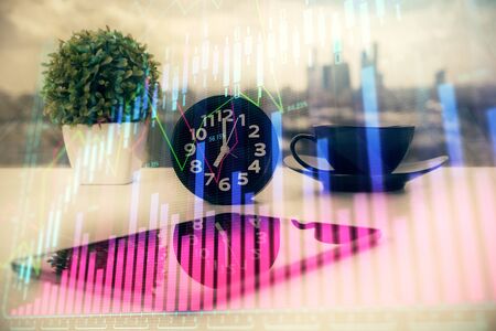 Double exposure of forex graph drawing and cell phone background. Concept of financial data analysisの写真素材