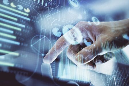 Multi exposure of mans hand holding and using a digital device and data theme drawing. Innovation...