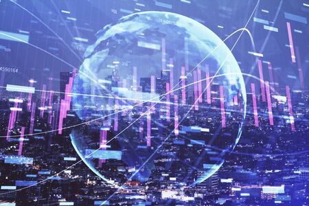 Financial graph on night city scape with tall buildings background double exposure. Analysis concept.の写真素材