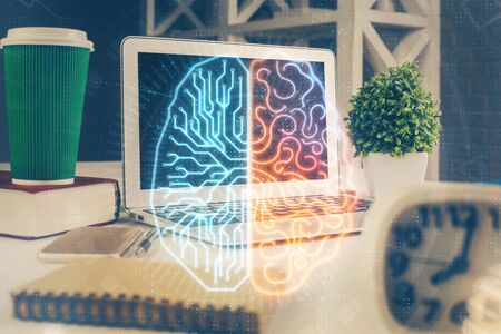 Double exposure of work space with computer and human brain drawing hologram. Brainstorm concept.の写真素材