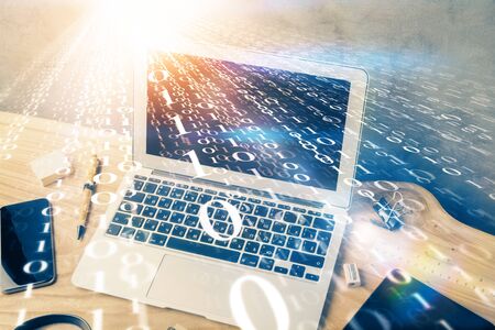 Double exposure of desktop computer and technology theme hologram. Concept of software development.の写真素材