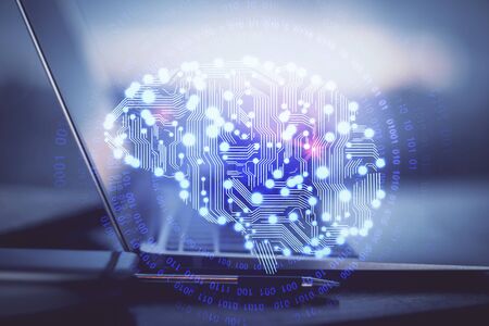 Multi exposure of work table with computer and brain hologram. Brainstorm concept.