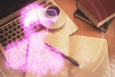 AR hologram drawings over computer on the desktop background. Top view. Multi exposure. Concept of...