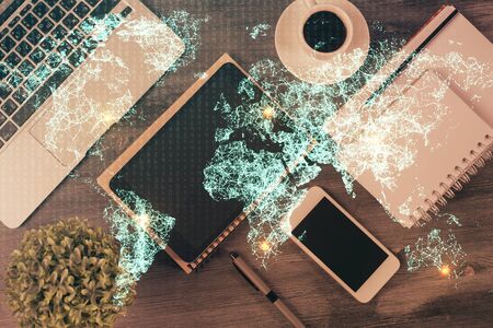 Double exposure of social network theme drawing over table with phone. Top view. People connecting concept.の写真素材